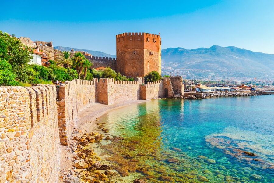 Alanya: Relax Boat Trip With Lunch & Swimming - Leaving the harbor with the Red Tower in view