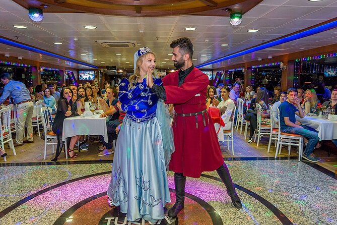 Bosphorus Dinner Cruise with Folklore Show & Belly Dancers - The first views: bridges, Beşiktaş, and the city at night