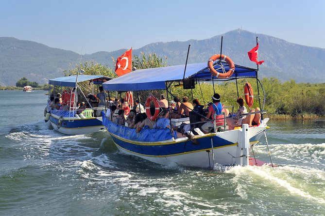 Dalyan Mud Baths and Turtle Beach Day Tour From Fethiye - Cruising the Dalyan River toward the tombs