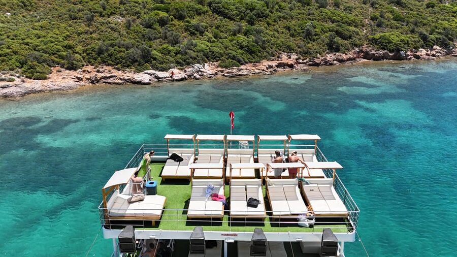 From Izmir: Full Day Boat Trip around Cesme with BBQ Lunch - Boarding a large boat with a reserved place