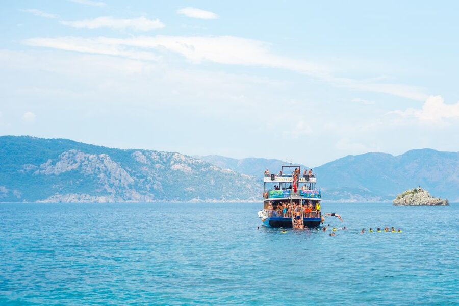 Marmaris: Bays Islands Boat Trip w/Lunch & Unlimited Drinks - Cruising Marmaris Bay from a sunbed