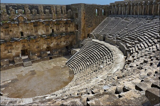 Perge Aspendos Side the Historical sites of Antalya - Side: ancient stones beside modern cafés
